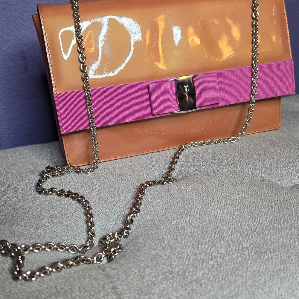 Salvatore Ferragamo Shiny Orange Clutch with Magenta Bow